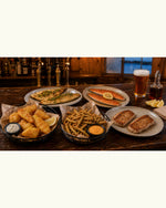 Pub Basket Sampler spread on a dark wood bar top