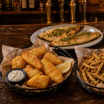 Beer battered walleye strips and breaded green beans in pub baskets
