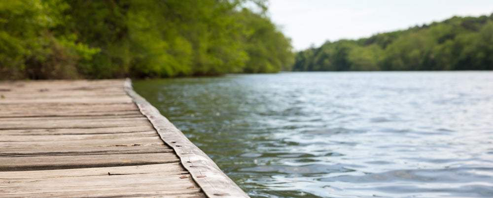 Wooden dock on a calm northern lake - Walleye Direct